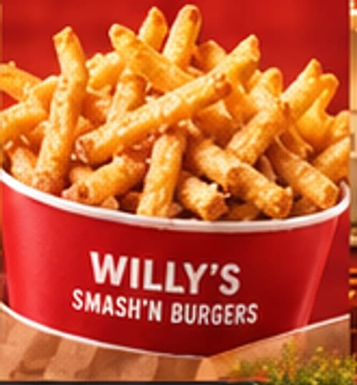 Crispy seasoned fries piled high in a Willy's fry cup